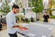 Office workers using the table tennis facilities in Ruskin Square during their lunch hour